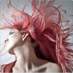 woman in a poncho, standing on a dirt road